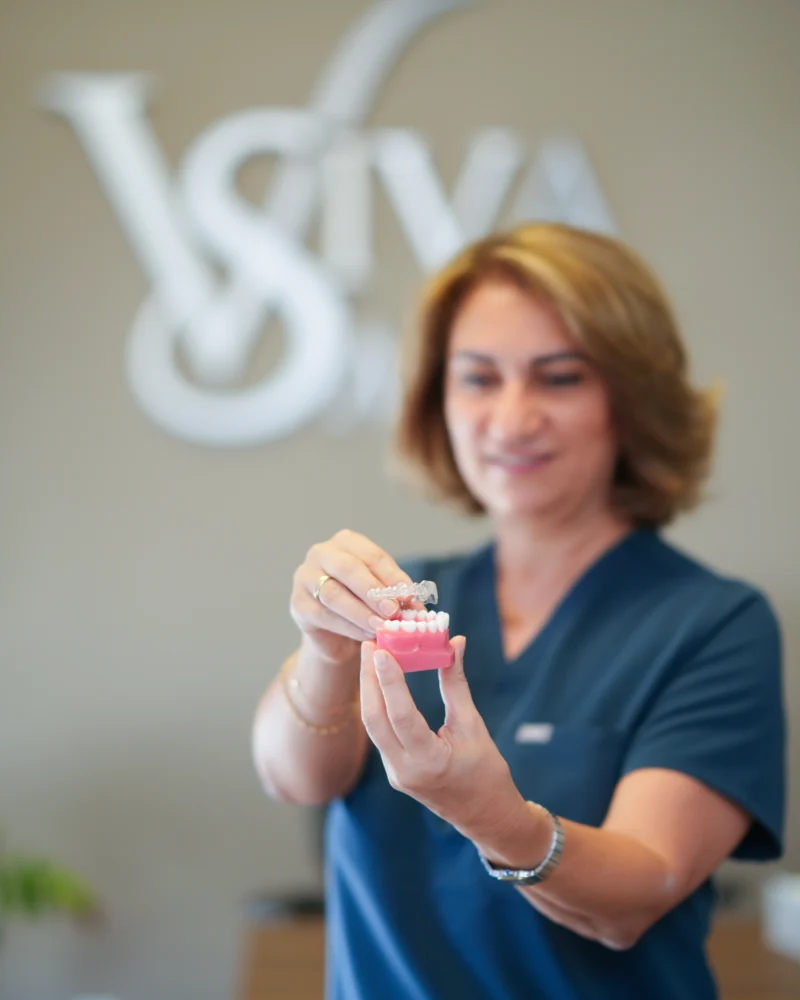 Dr. Gohar Holding Invisalign Tray